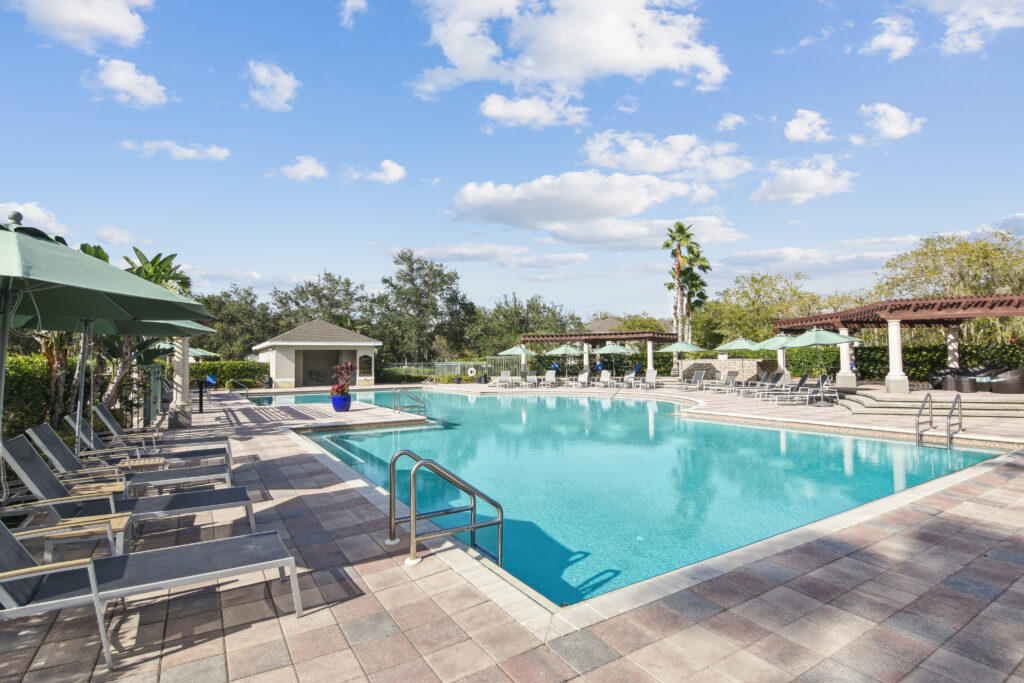 a swimming pool with chairs