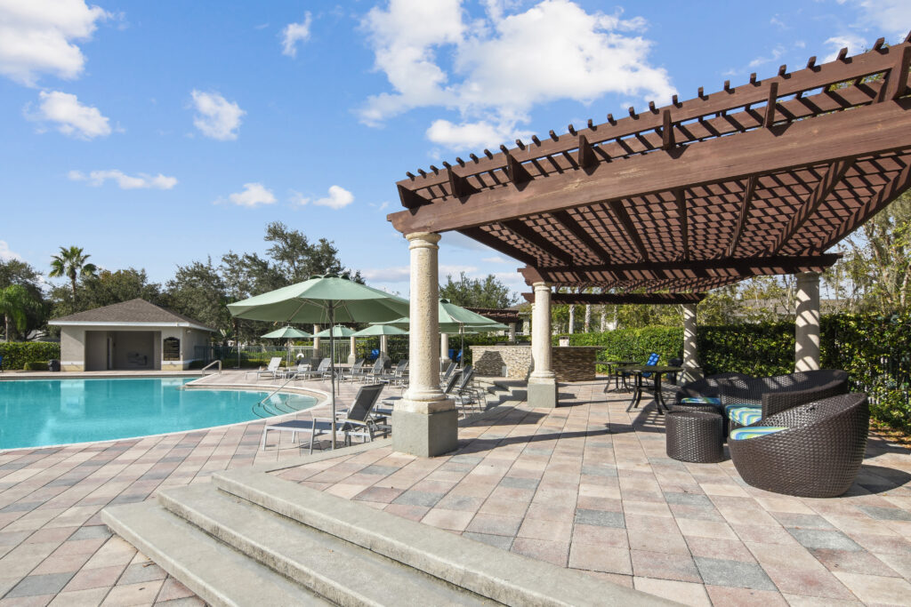 a swimming pool with chairs