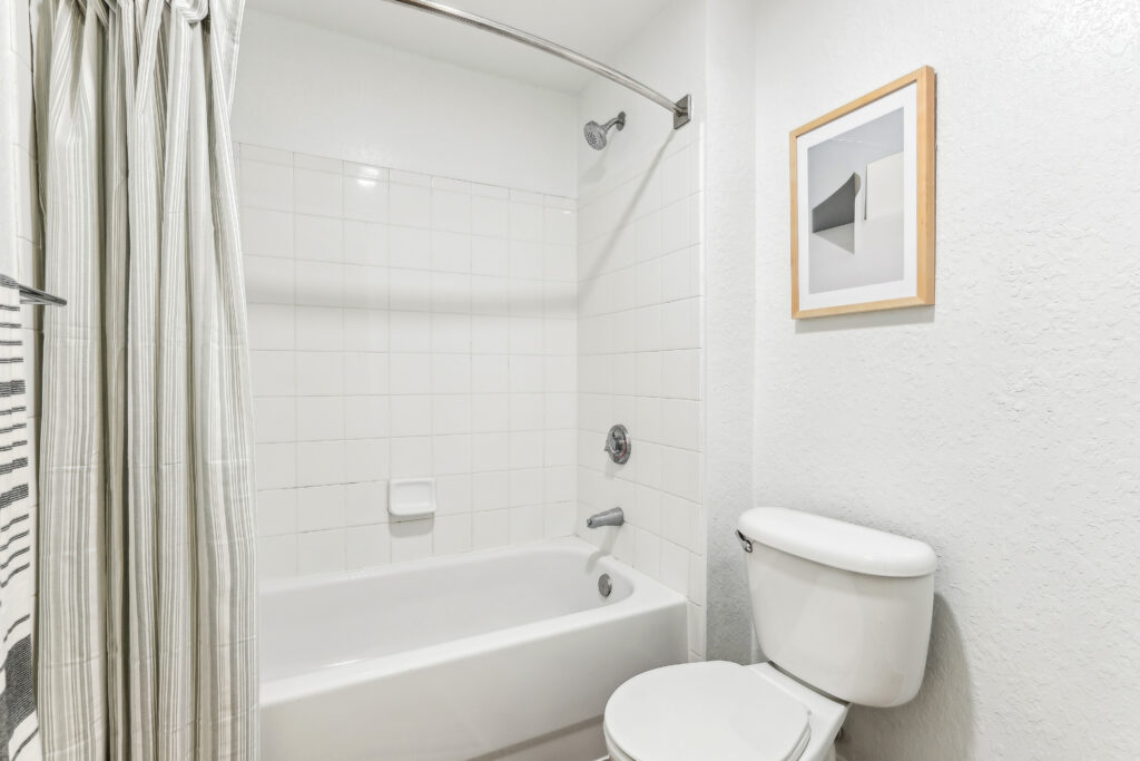 Bathroom with toilet and tub/shower combo